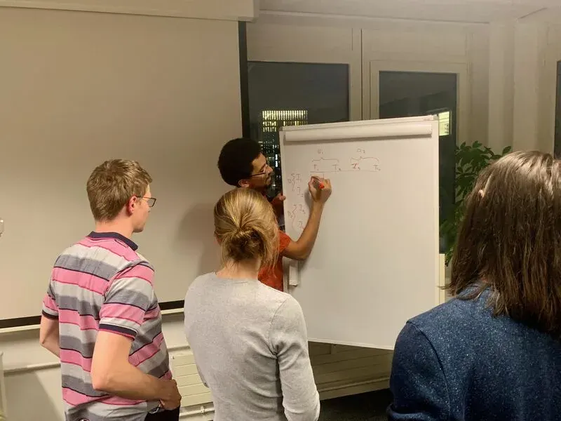 Basil Mustafa explains a diagram at ZurichNLP #1.